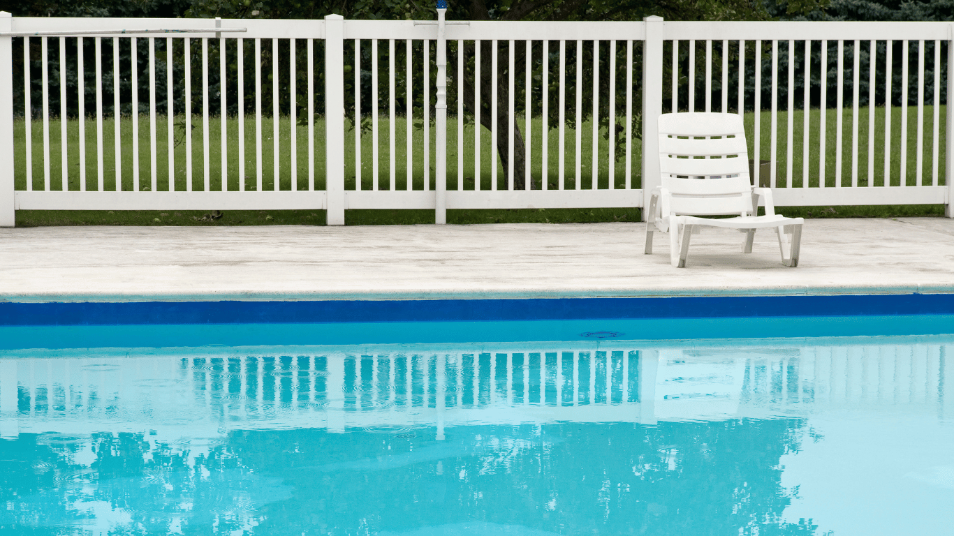 white fence around a pool